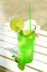 Refreshing cocktail on table, outdoors