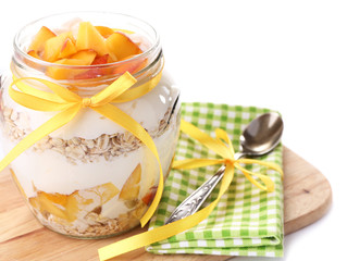 Healthy breakfast - yogurt with  fresh peach and muesli served
