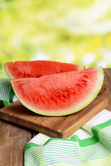 Juicy watermelon on table on bright background