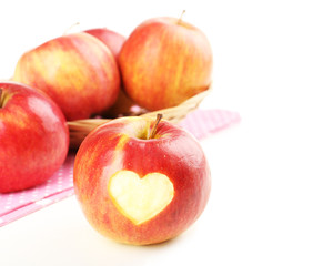 Red apple with heart isolated on white