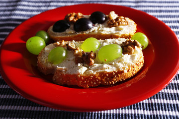tasty bread with grape and cheese, close up