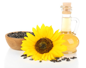 Sunflower with seeds and oil isolated on white