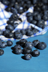 Tasty ripe blueberries, on wooden table