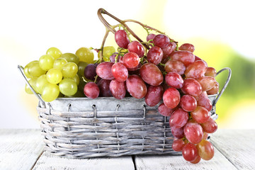 Bunches of ripe grape in wicker basket