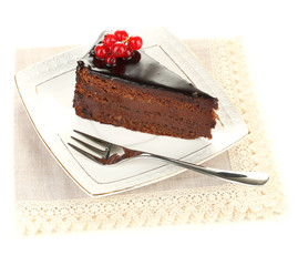 Chocolate cake with fresh berries on plate, isolated on white