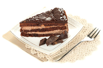 Chocolate cake on plate isolated on white