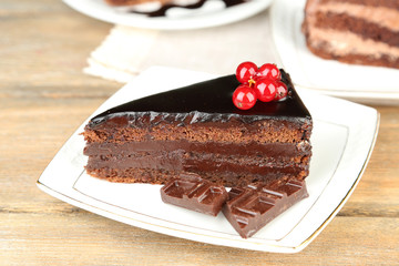 Chocolate cakes  on plates, on  wooden background