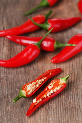 Red hot chili peppers on wooden background