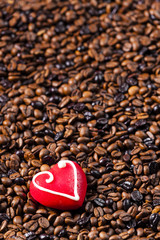 still life of coffee beans and marzipan heart