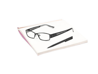 book with glasses and pen isolated on white background