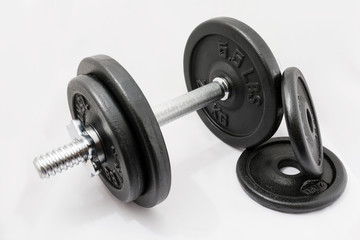 Fototapeta na wymiar Fitness exercise equipment dumbbell weights