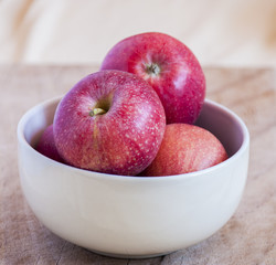 Fresh apples in a bowl close up