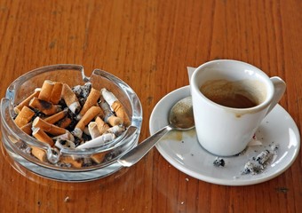 ashtray chock full of cigarette butts