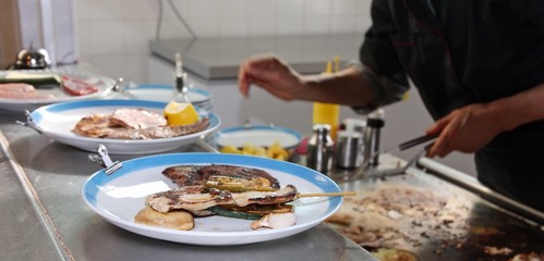 restaurant kitchen during the preparation of vegetable dishes