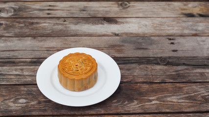 Moon Cake close up on old wood table , Chinese Culture