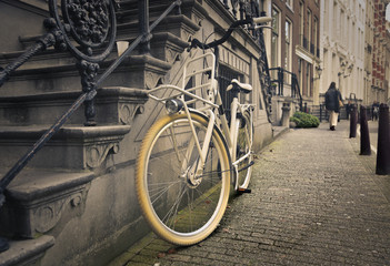 an old bicycle in a grey street