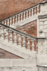 Obraz premium Staircase with a balustrade in old house, Rome, Italy