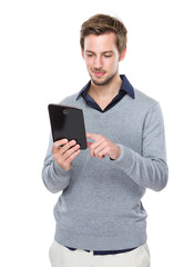 Fototapeta na wymiar Caucasian man use of digital tablet