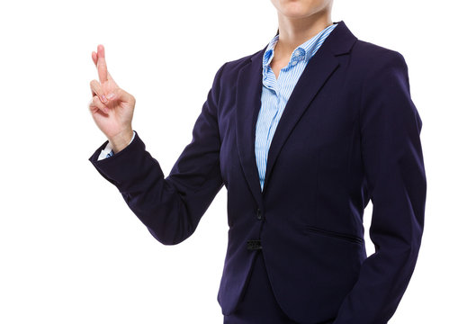 Businesswoman with finger crossed