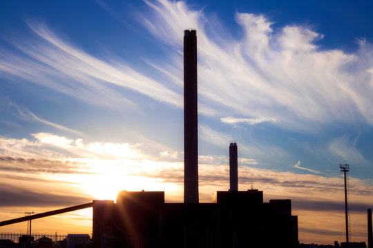 A Factory Silhouette In A Magnificent Sun Set