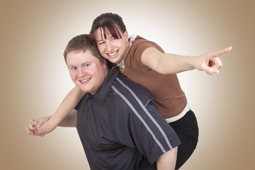 Man carrying woman piggyback