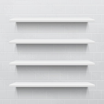 Four white realistic shelves against brick wall