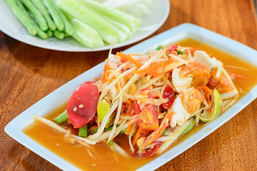 Spicy papaya salad with salted eggs