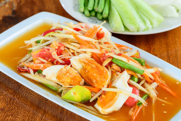 Spicy papaya salad with salted eggs