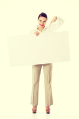 Beautiful business woman pointing on copy space.