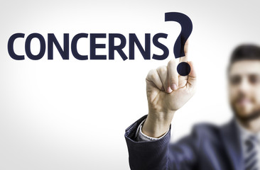 Business man pointing the text: Concerns?