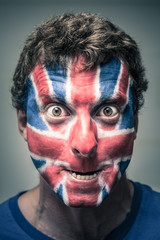 Spooky man with British flag painted on face