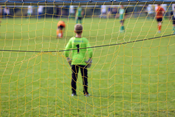 Young boys play football match