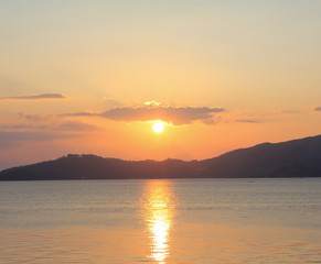 Fototapeta na wymiar sunset on the beach mountain