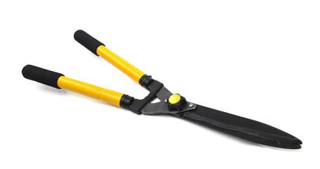 Scissors to cut the grass isolated on white background