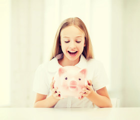 child with piggy bank