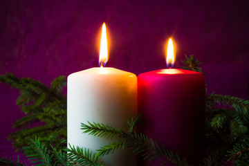 Obraz na płótnie Canvas Christmas ornaments lighted candles spruce twigs