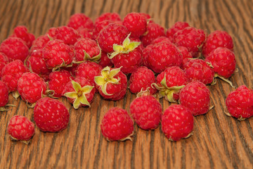 Fresh raspberries on wooden background