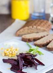 slices of roast beets, corn and garlic for a sandwich