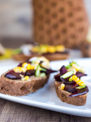 vegetarian sandwich with vegetables on white plate