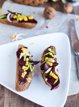 vegetarian sandwich with vegetables on white plate