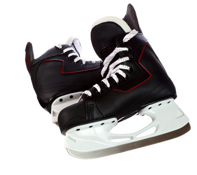 Pair of black hockey skates isolated on white background