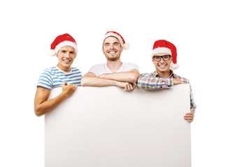 Young men in santa hats