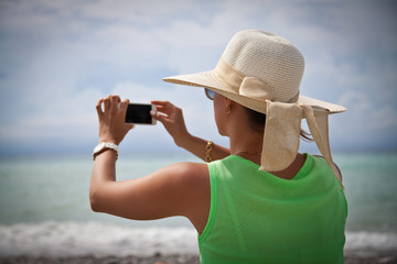 woman in hat on the beach