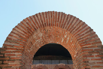 Closeup picture of ancient arch part of St. George church
