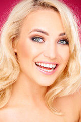 Naklejka premium Laughing happy young blond woman