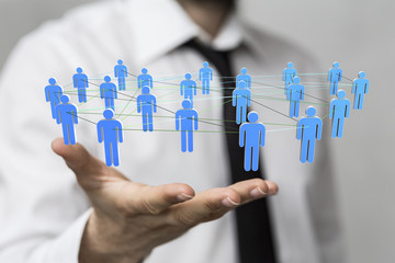 choice -  Businessman holding 3D rendering group of blue people 