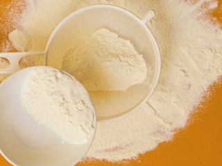 Preparation for baking, ingredients flour sifting.