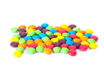 A colorful assortment of shiny round gumballs.