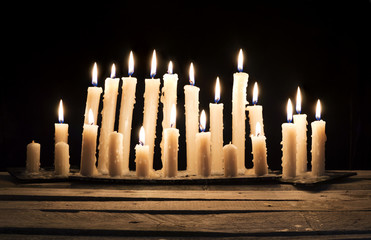 Burning candles in the darkness