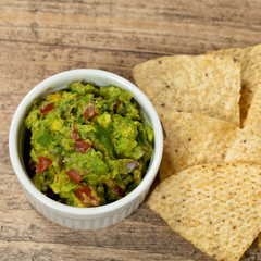 Bowl of Guacamole dip and nachos
